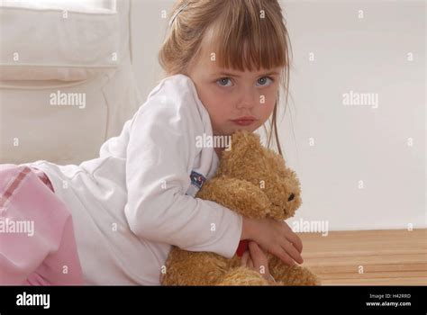 Girl 4 Years Looking At Camera Sad Hand Holding Teddy Bear