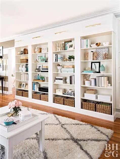 I then added the shelves and backing to the outer bookshelves and placed them back up on the cabinets. You Can Build this DIY Library Wall for Less than $600 ...