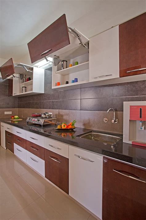 Since it is hanging in the wall, you will save more space and you can use the space remaining for other use. indian kitchen kitchen cabinet layout tool modular storage ...