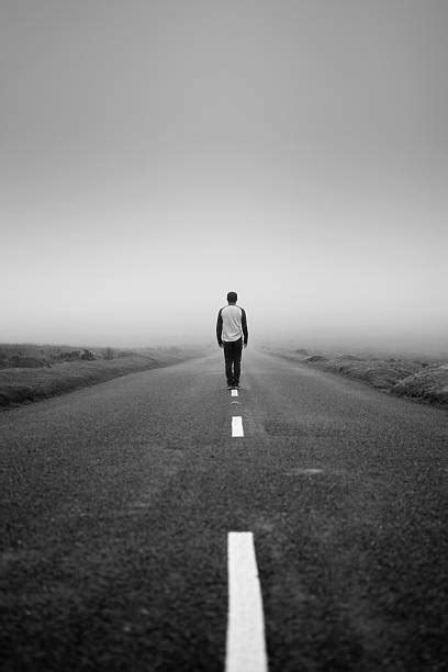 Man Walking Long Road Stock Photos Pictures And Royalty Free Images Istock