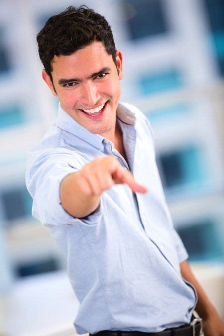 Business Man Pointing At The Camera And Smiling Freestock Photos