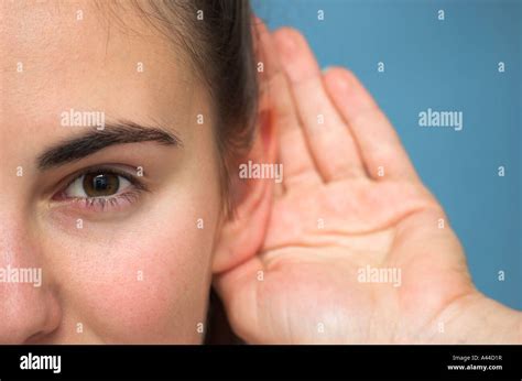 Young Woman Cupping Hand Ear Hi Res Stock Photography And Images Alamy