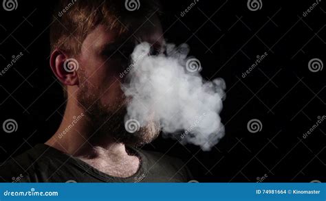 smoking man blows smoke from his mouth black silhouette slow motion stock footage video of
