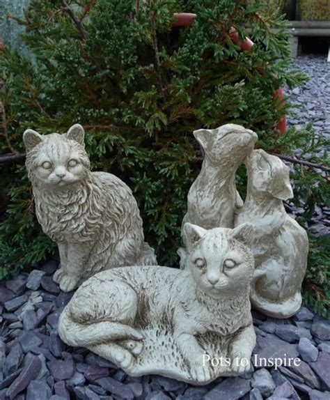 A sleek black design means they won't overwhelm other design aspects. Laying Down Cat Garden Ornament | Woodside Garden Centre ...