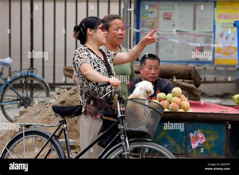 Chinese Women In Discussion On A Street Of Hohot Inner Mongolia
