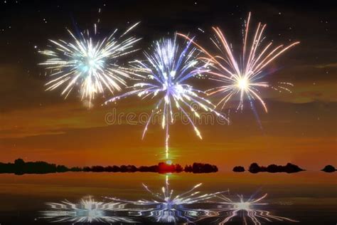 Beautiful Fireworks In Front Of A Sunset At The Beach Stock Photo