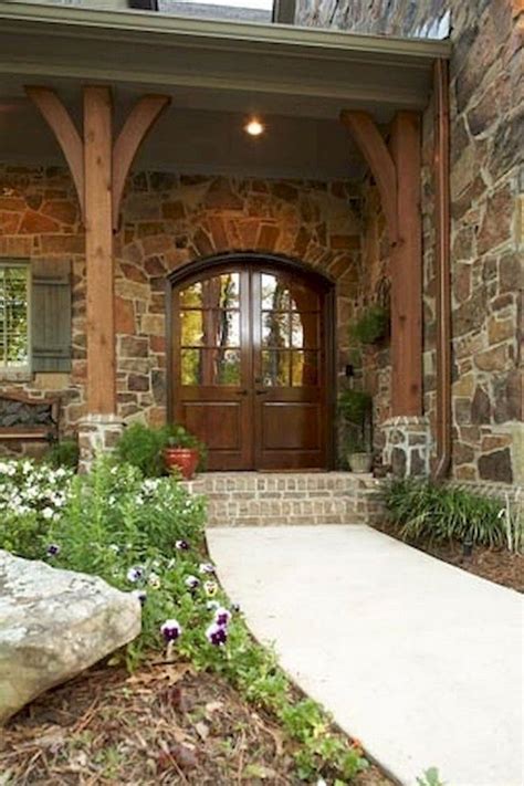 Beige brick front porch with red door. Create the design of your Barndominium Exterior or let ...