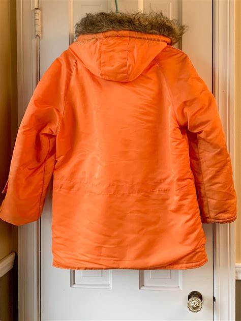 vintage 1970s orange parka with faux fur trimmed hood mod winter jacket pirates cove size m