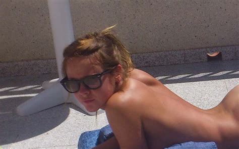 Girl Sunbathing Nude While Enjoying A Book Naughty Exposures