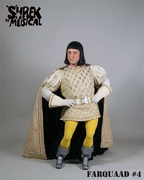 A Man Dressed In Medieval Clothing Poses For A Photo