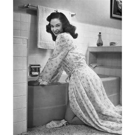Portrait Of A Young Woman Bending Over A Bathtub In The Bathroom Poster