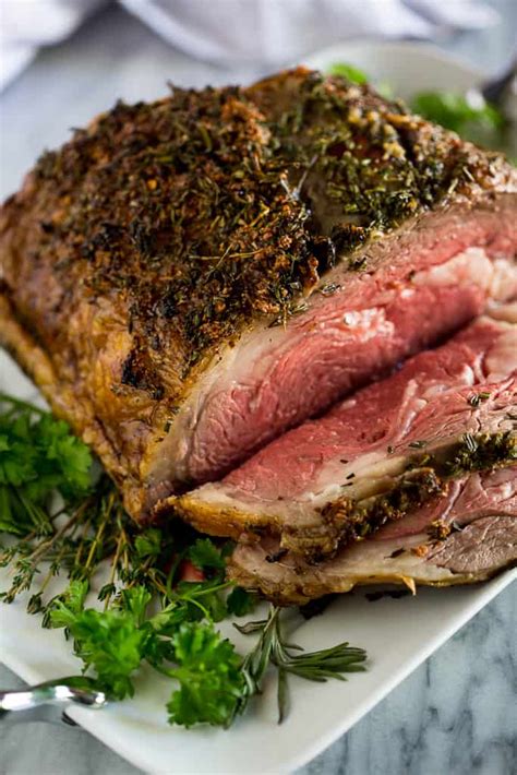 a slow roasted prime rib recipe with step by step instructions and tips for how to slow roast a