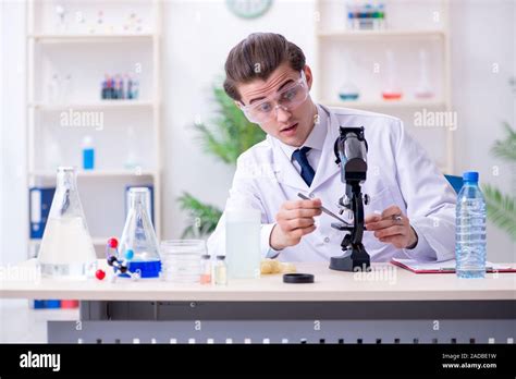Young Male Chemist Experimenting In Lab Stock Photo Alamy