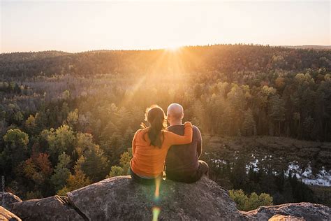 Couple Enjoying Beautiful Sunset View On Mountain by Preappy - Couple, Togetherness