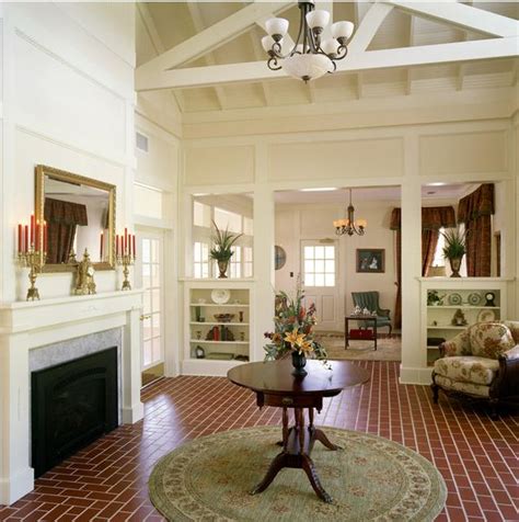 Floor to ceiling bookcases with ladder. Delorme Designs: BOOKCASE ENTRYWAYS/DIVIDERS