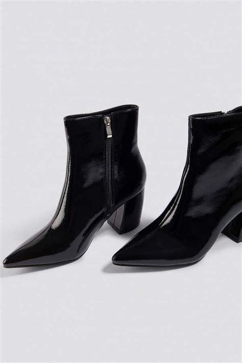 When you buy through links on our site, we may earn an affiliate commission. Na Kd Shoes Structured Patent Mid Heel Boots Black