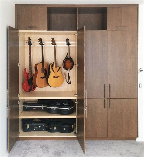 Guitar Hanging System In Cabinet Used In Home For Guitar Storage And