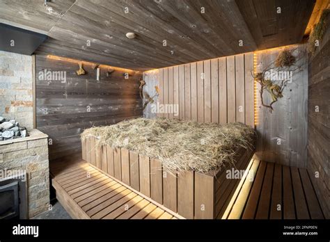 Interior Of A Wooden Sauna Steam Room Bathhouse With Hay On Wooden