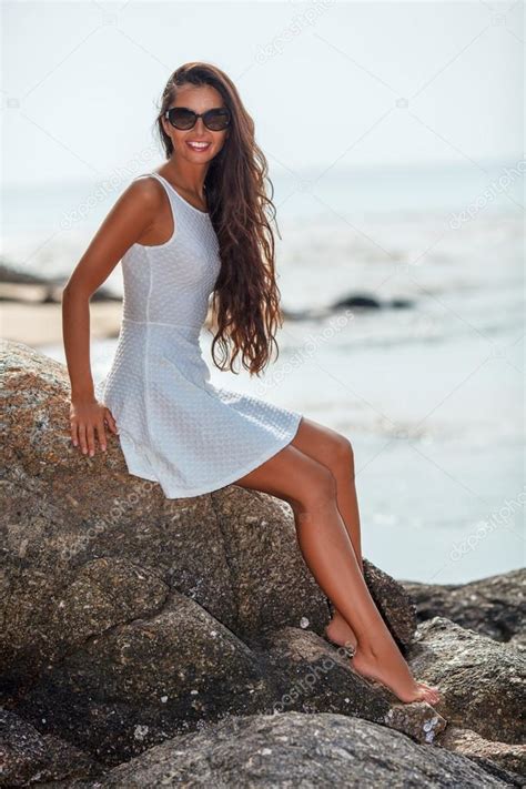 Beautiful Tanned Woman Sitting On Stone Stock Photo Chesterf