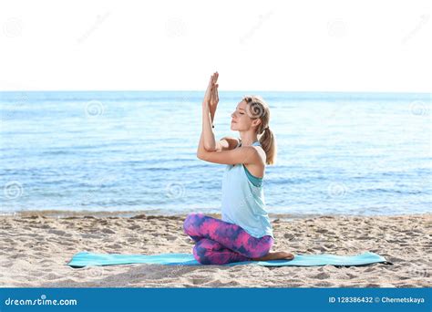Young Woman Doing Yoga Exercises On Beach Stock Photo Image Of