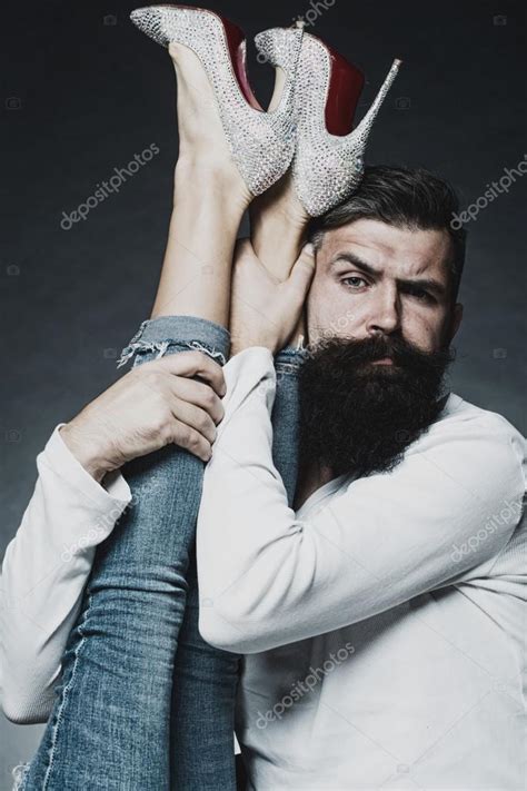 Man Holding Legs Of Woman Stock Photo By Tverdohlib Com 88574096