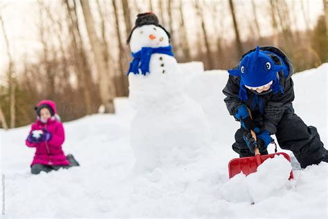 Kids Building A Snowman