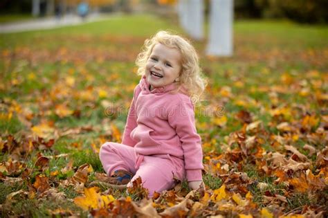 Cute Blond Toddler Children Boy And Girlwalking In Autumn Park On
