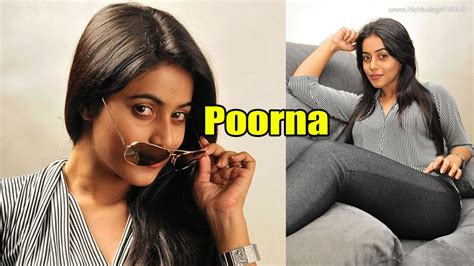 South Babe Poorna In Tight Jeans Posing Seductively On A Couch