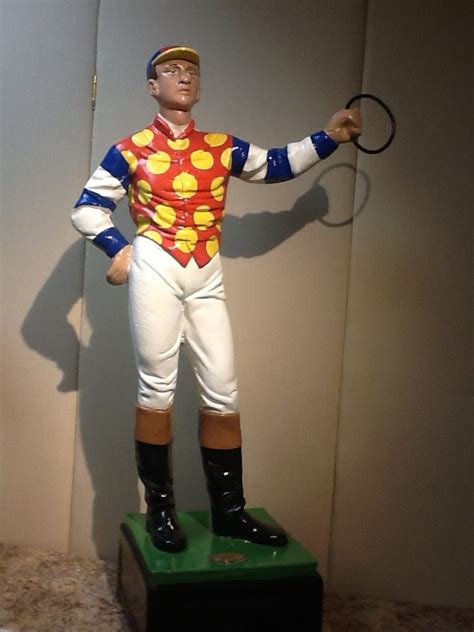 A vintage cast iron jockey figurine. History of The Lawn Jockey - Saratoga Signature Furniture ...