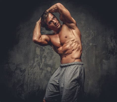 Shirtless Muscular Guy Posing In Studio Stock Photo Fxquadro