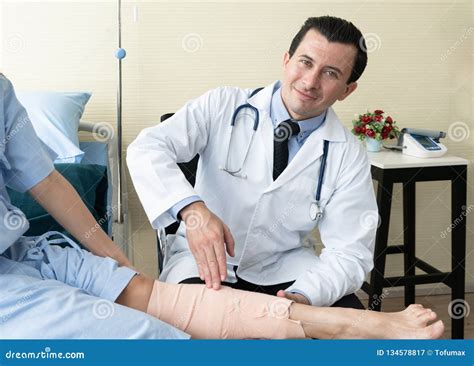 team of doctor examining a female patient stock image image of people professional 134578817
