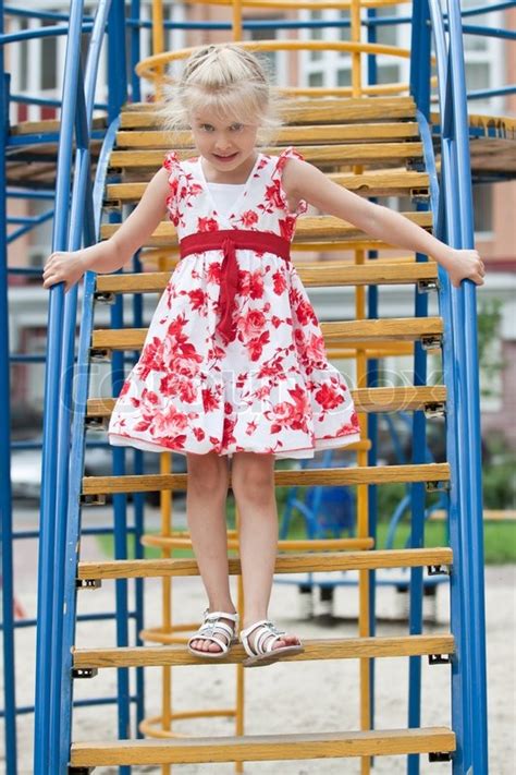 Cute Little Girl On Outdoor Playground Having Fun Stock