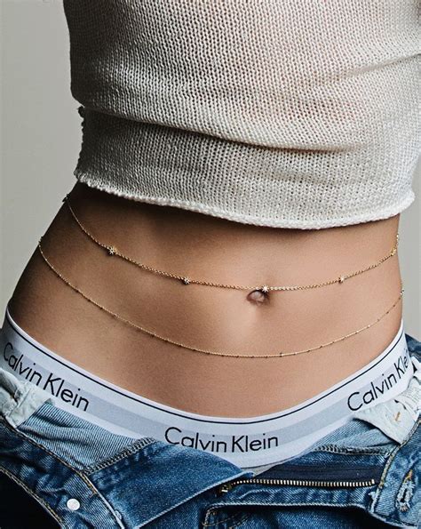 Dainty Gold Belly Chains Layered With Denim And A Crop Top