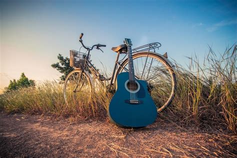 Colorful Of Bicycle With Guitar In Meadow Photo Free Download