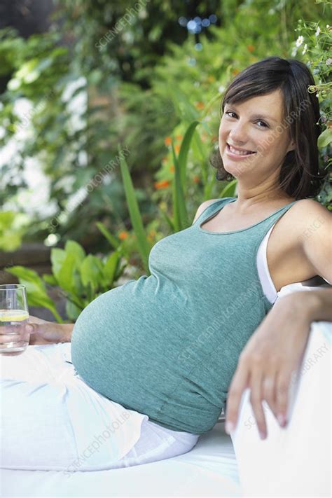 Pregnant Woman Relaxing Outdoors Stock Image F0138286 Science Photo Library