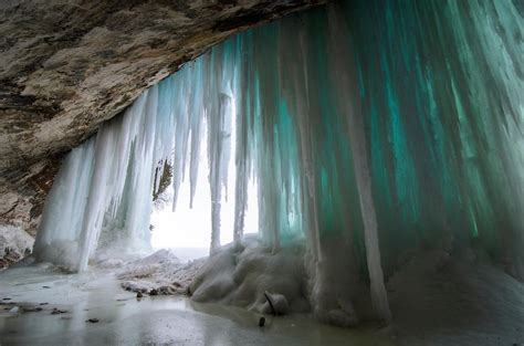 The Impressive Colorful Ice Caves Along The Grand Island Shoreline And