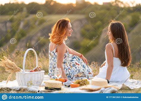 Two Beautiful Girlfriends Spend Time Together On A Picnic Stock Image Image Of Girl French