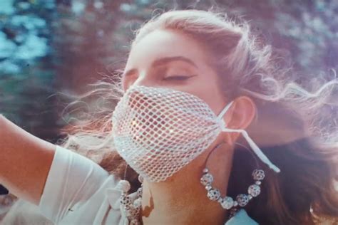 Jazz age meets ipod age. Lana Del Rey rewears mesh mask in 'Chemtrails Over the ...