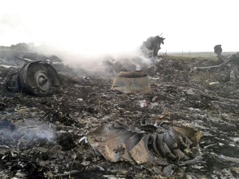 Smoking Debris Covers Malaysia Airlines Crash Site