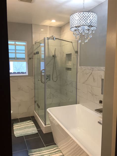 It can be quite intimidating, especially if you don't know where to begin. Bathroom renovation with tub shower and chandelier ...