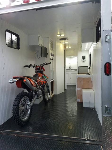 With garages from 4 to 16 feet deep, we can build the fifth wheel for whatever toys you're hauling — whether it's bicycles, a utv, golf cart or kayaks — and still have plenty of living space. Doing a fit check for the tire chock. | Cargo trailer camper, Cargo trailer conversion, Toy ...