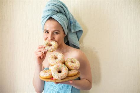 The Girl In A Towel Has Breakfast In The Bed A Young Attractive Woman Eats Donuts In Bed Stock