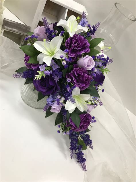 deep purple roses lavenders white lilies lavender roses with greenery teardrop purple flower