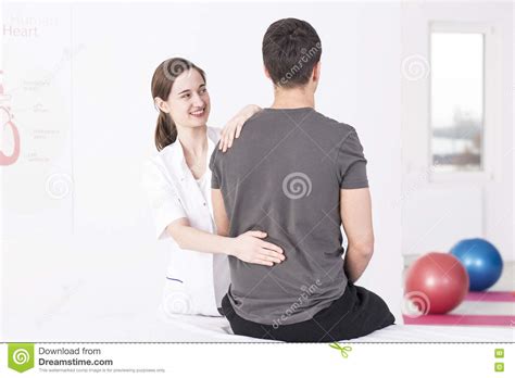 Trying To Locate the Source of His Pain Stock Image - Image of spine