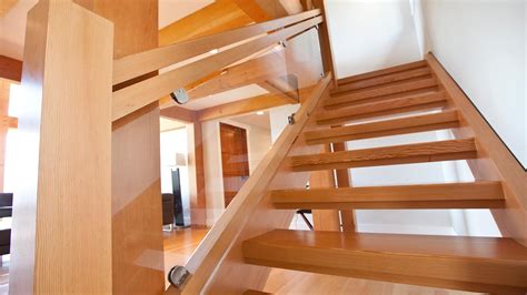 A modern staircase design like this one is minimal and fits well in most modern homes. Custom Timber Stairs and Railings | Island Timber Frame