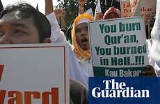 quran burning muslims protest against protests burn church