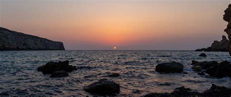 Download Wallpaper 2560x1080 Sea Water Stones Sun Sunset Dual Wide