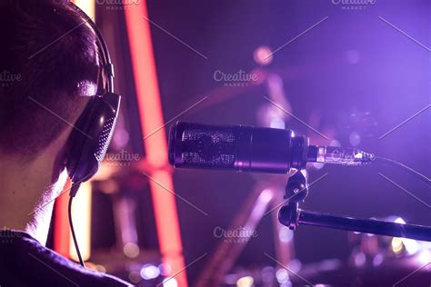 Person with headphones and Studio microphone close-up, in a recording ...