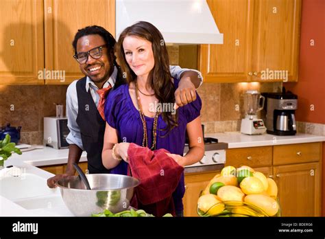 Interracial Couple In Kitchen Stock Photo Alamy