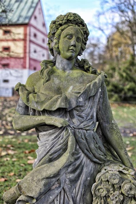 Old Moss Covered Statue Of The Girl Holding Flowers Stock Image Image Of Long Czechia 110070547